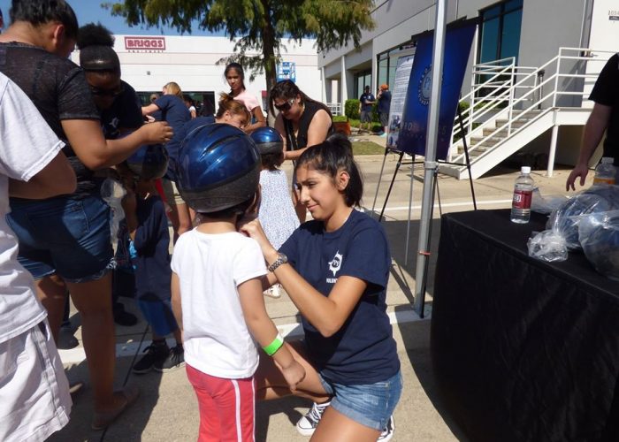 volunteer helping kid briggs carnival